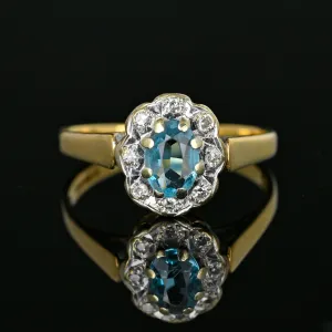 Vintage Diamond Halo Blue Topaz Ring in Gold