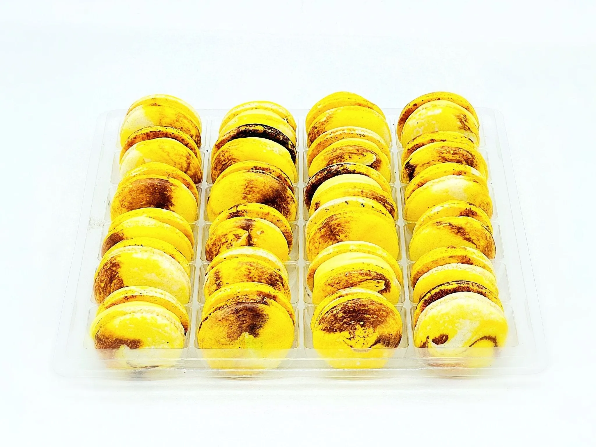 Wholesale Yellow Planet (Lemon Chocolate) Vegan Macarons | Available in 24 & 48 Pack